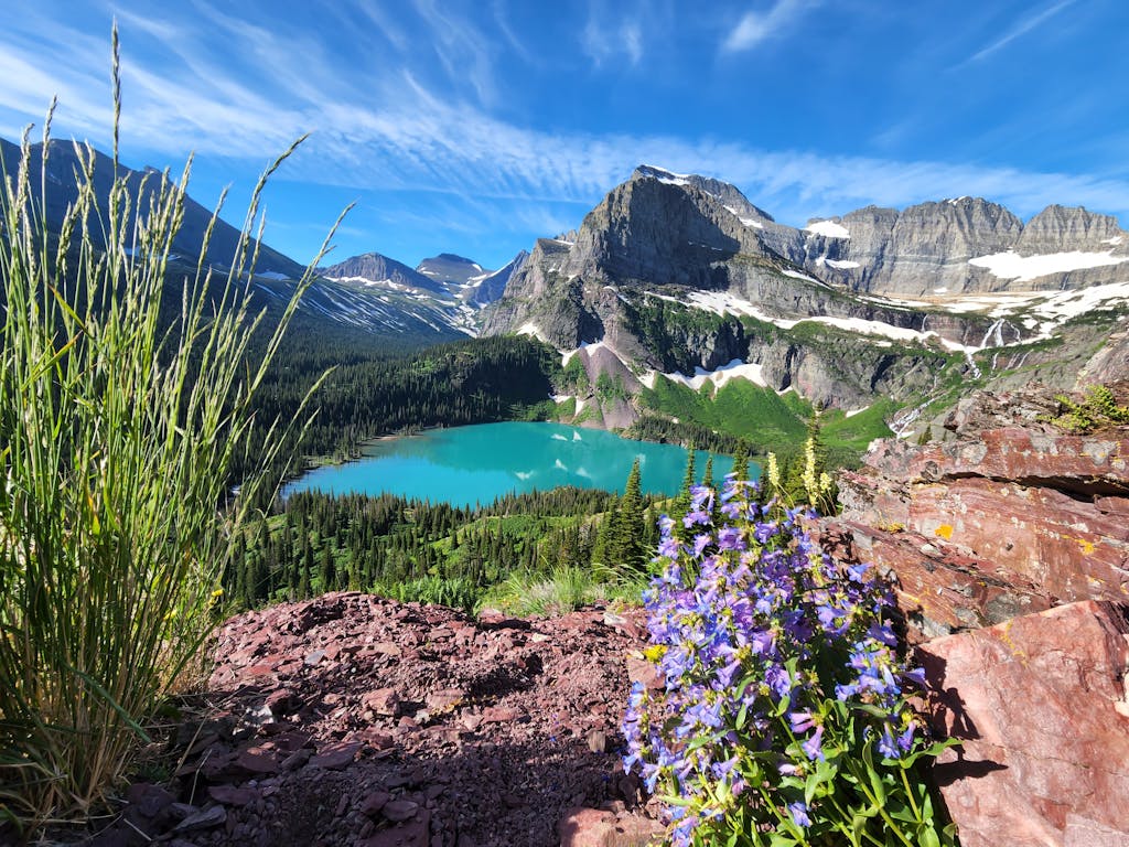 Breathtaking view of Emerald Lake surrounded by mountains in Glacier National Park, Montana.