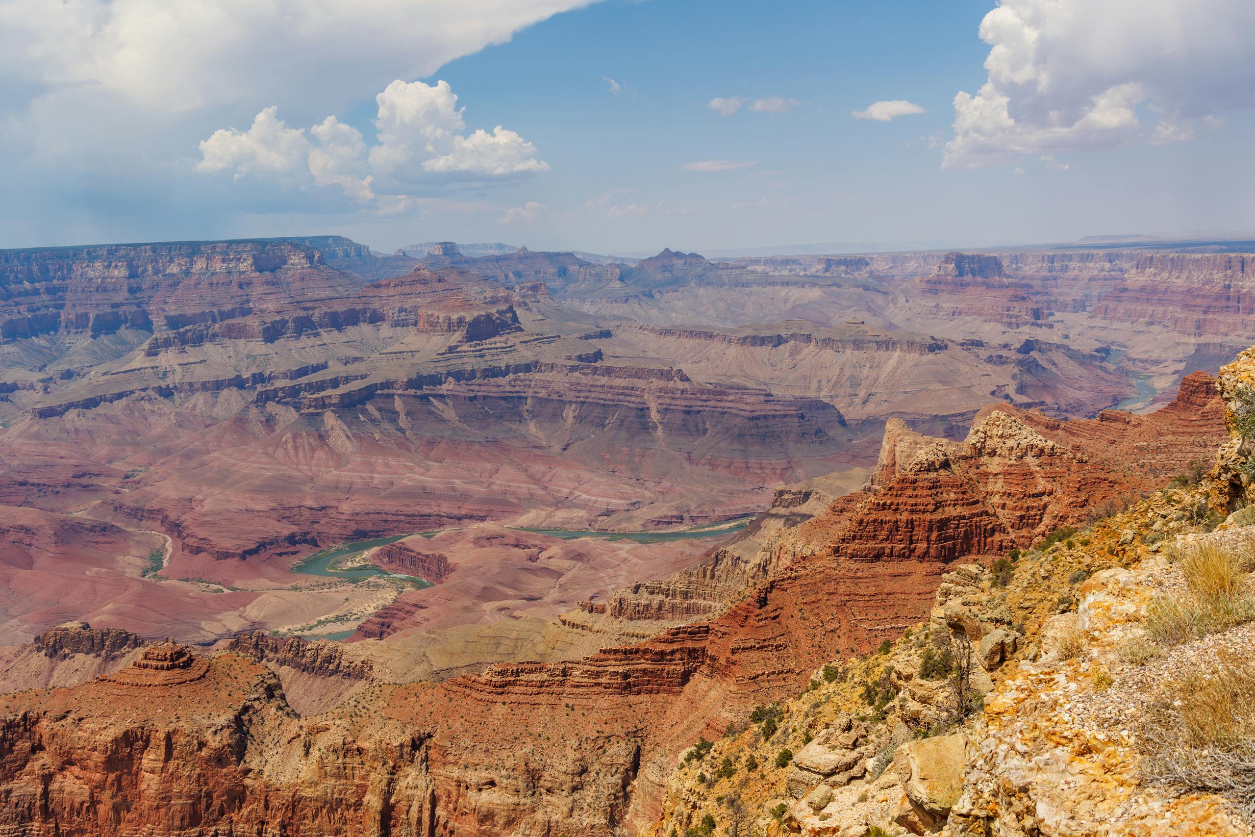 Stunning panoramic view of the Grand Canyon, showcasing its geological wonders under a clear sky.
